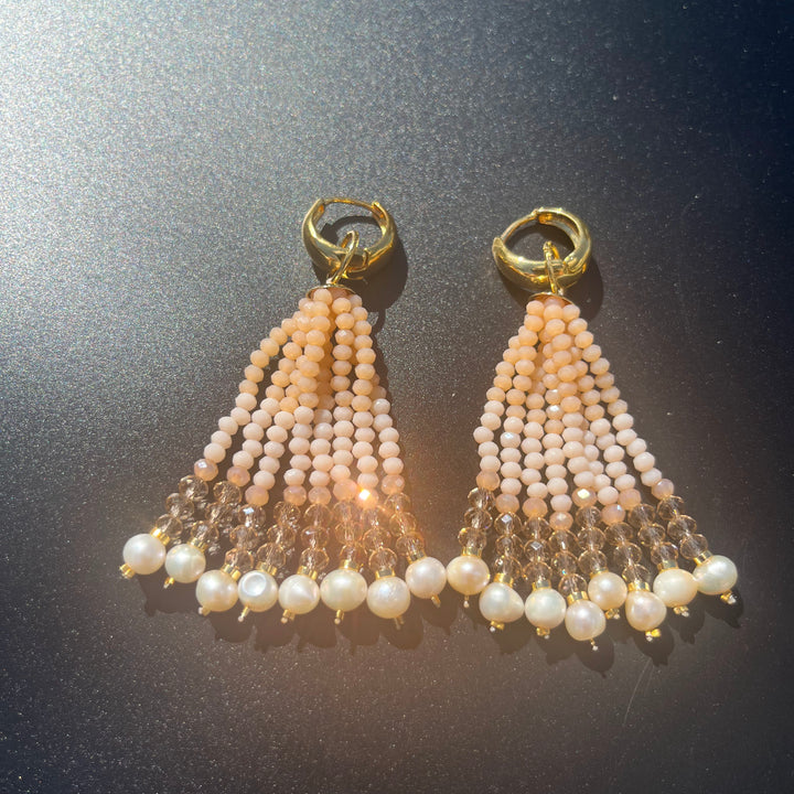 Long crystal fringe earrings with mini pearls plated in 18k gold.