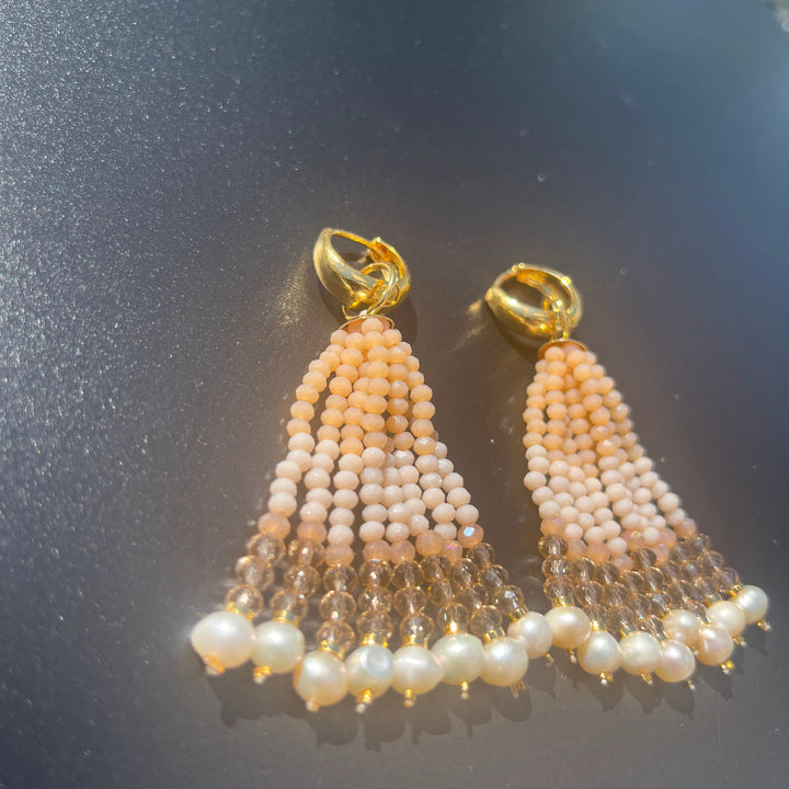 Long crystal fringe earrings with mini pearls plated in 18k gold.