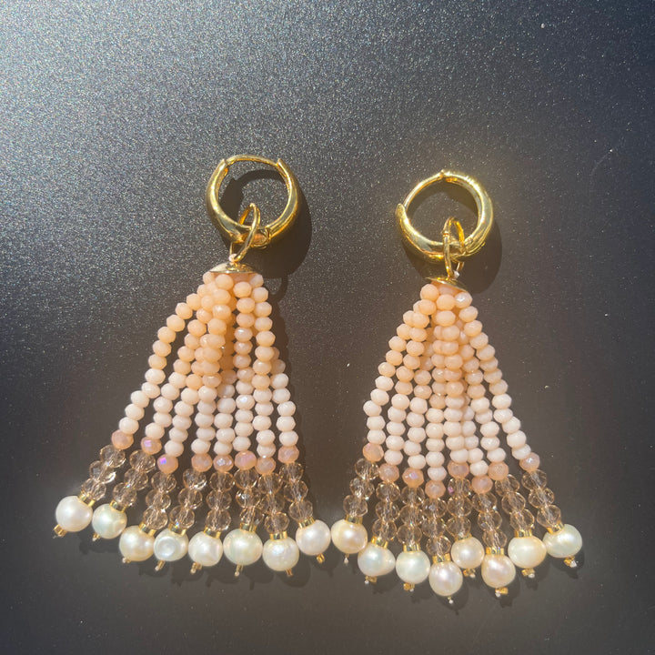 Long crystal fringe earrings with mini pearls plated in 18k gold.