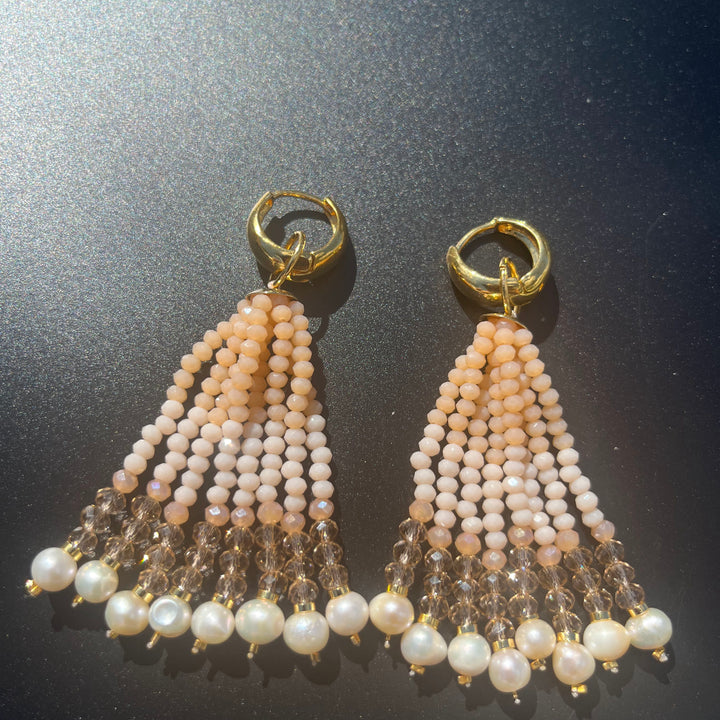 Long crystal fringe earrings with mini pearls plated in 18k gold.