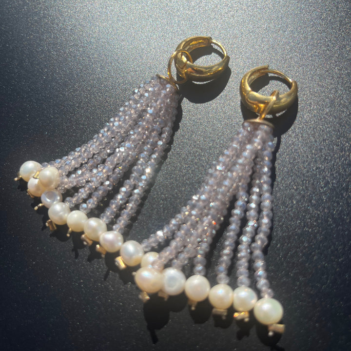 Long crystal fringe earrings with mini pearls plated in 18k gold.