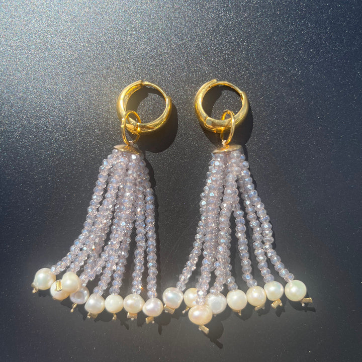 Long crystal fringe earrings with mini pearls plated in 18k gold.